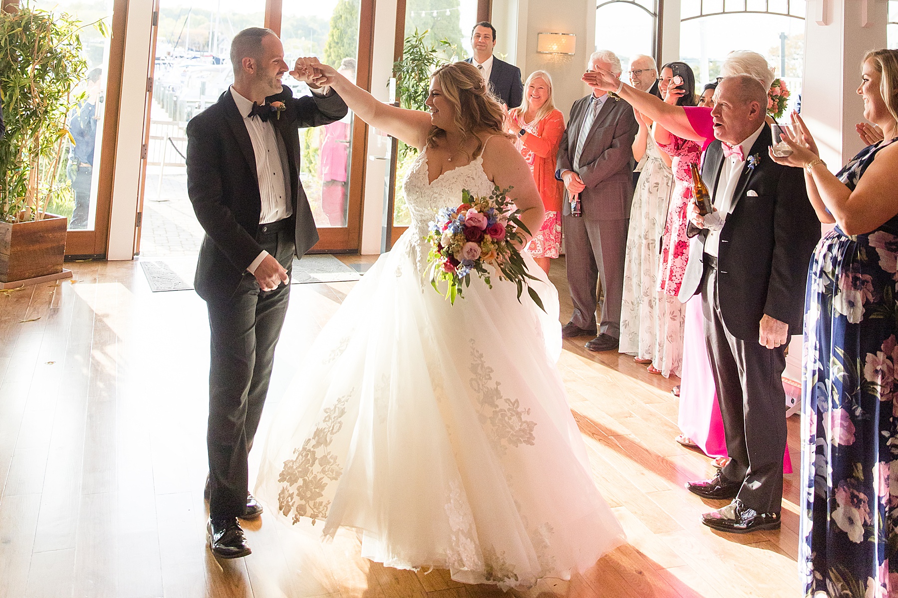 bride and groom enter wedding reception