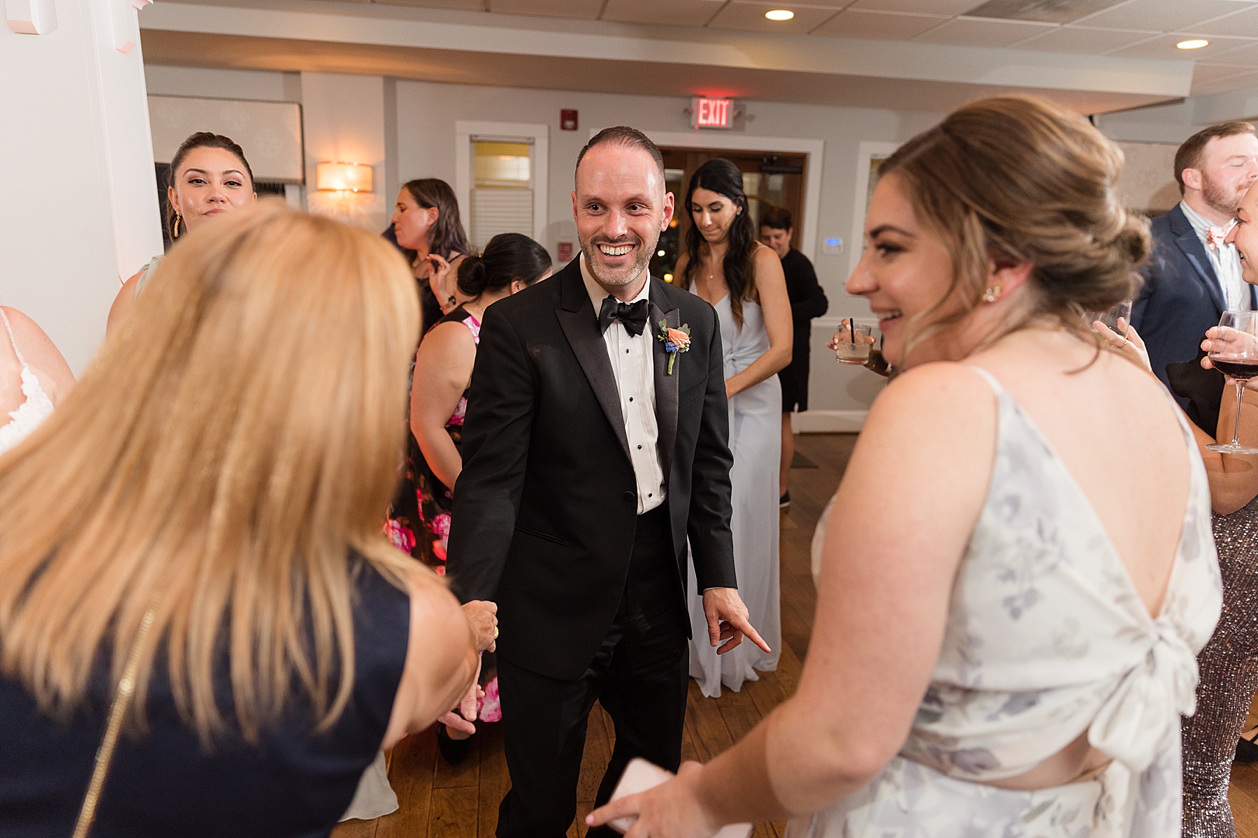 candid wedding guest dancing