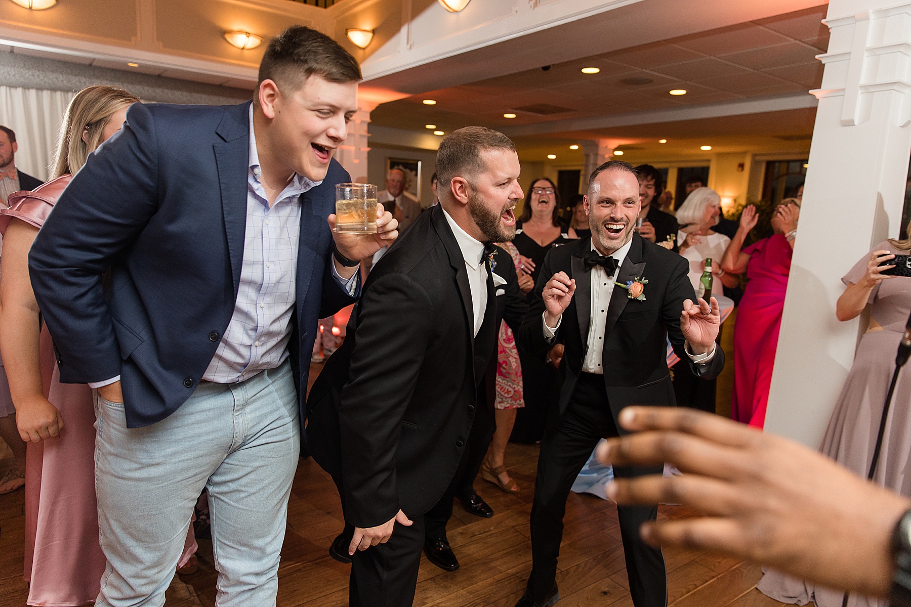 candid wedding guest dancing