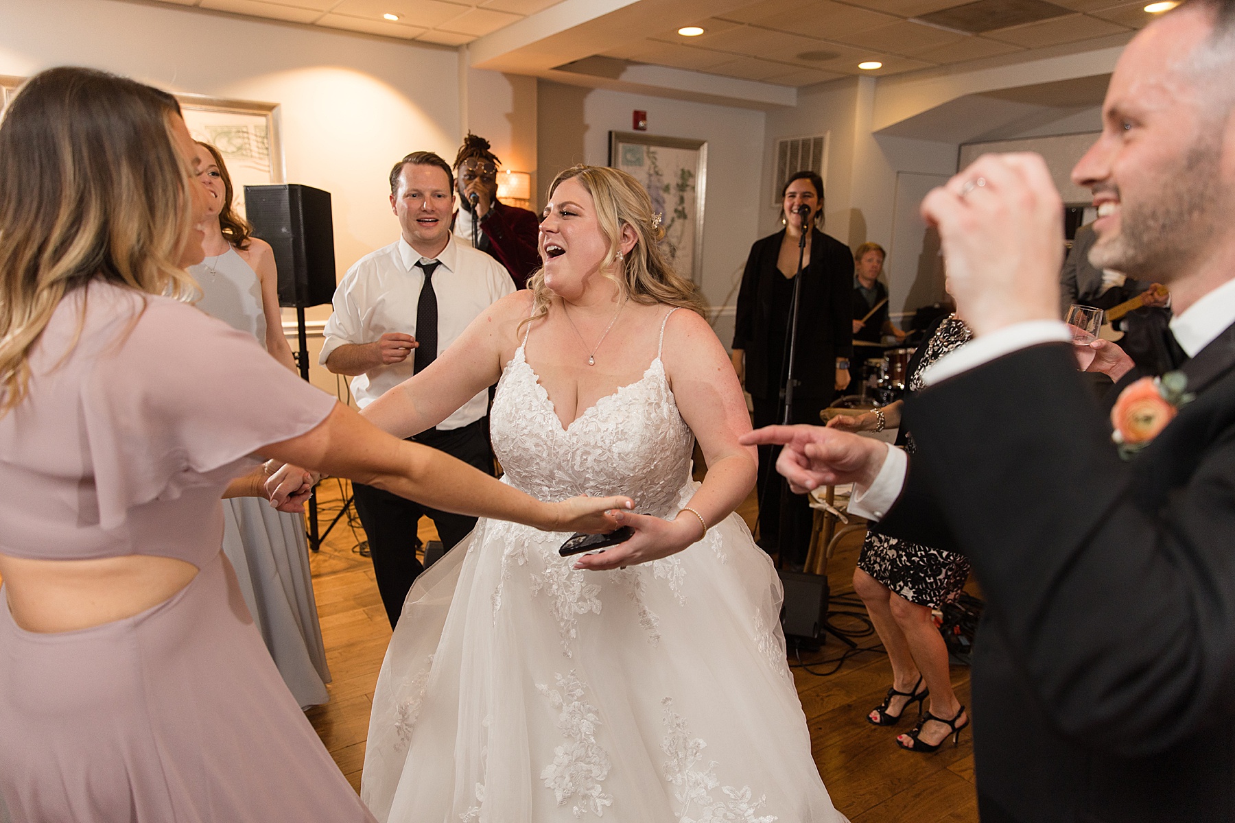 candid wedding guest dancing