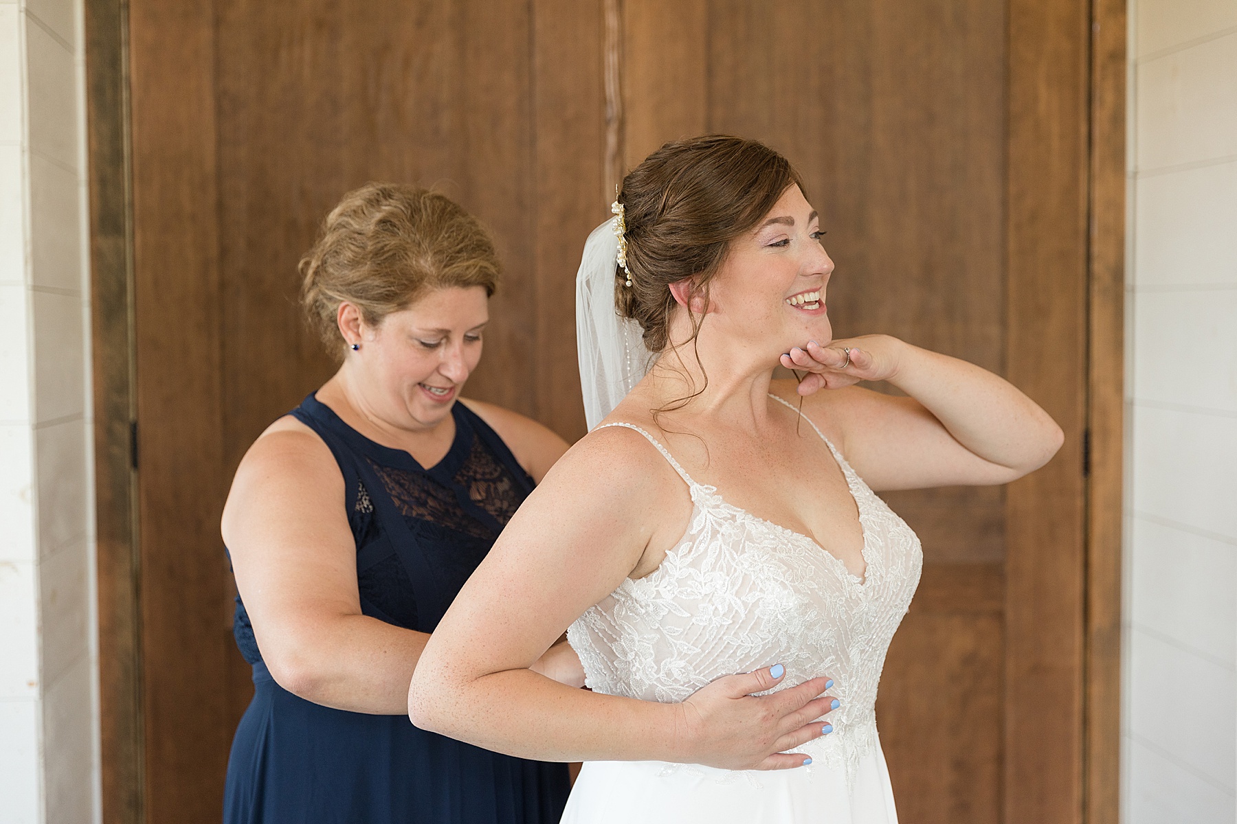 bride getting into gown