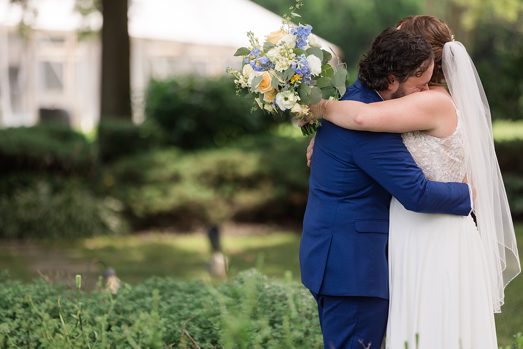 bride and groom first look embrace