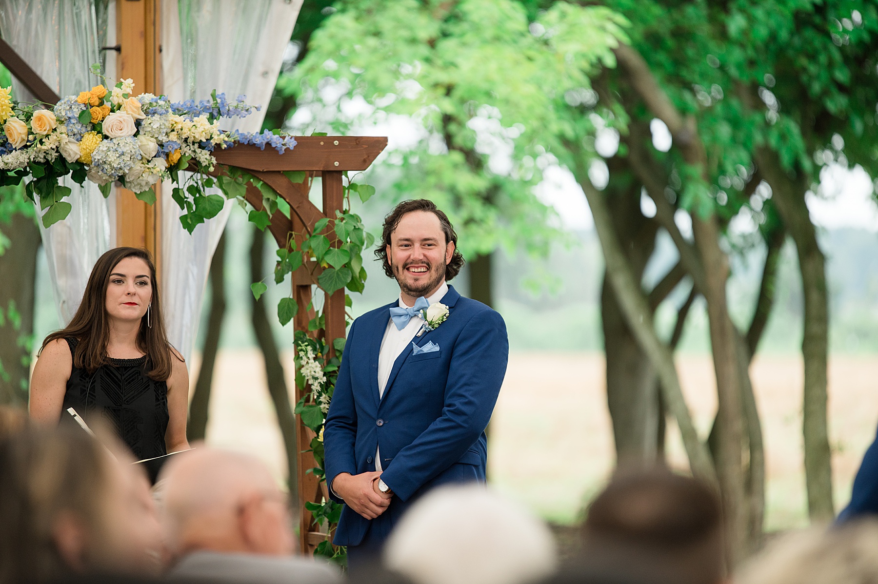 groom sees bride down aisle