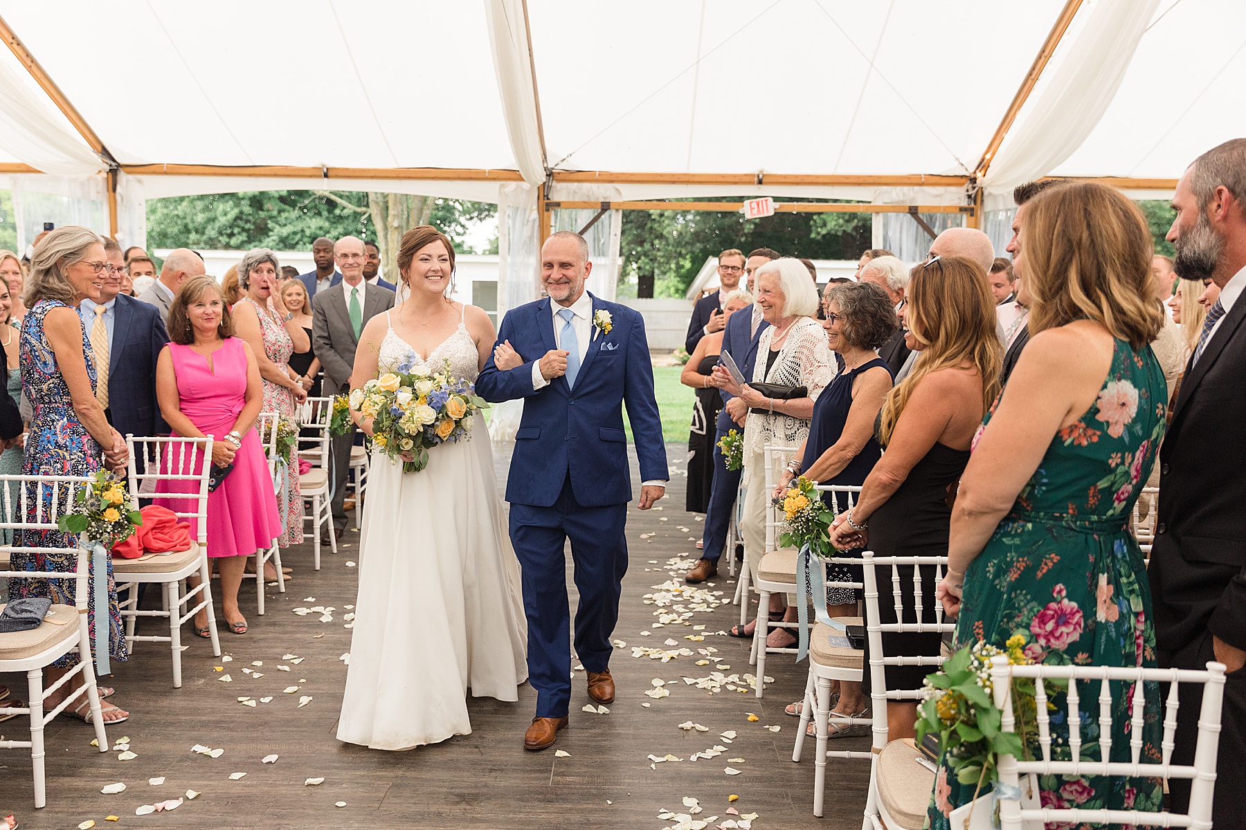 bride and her dad walk down aisle ceremony