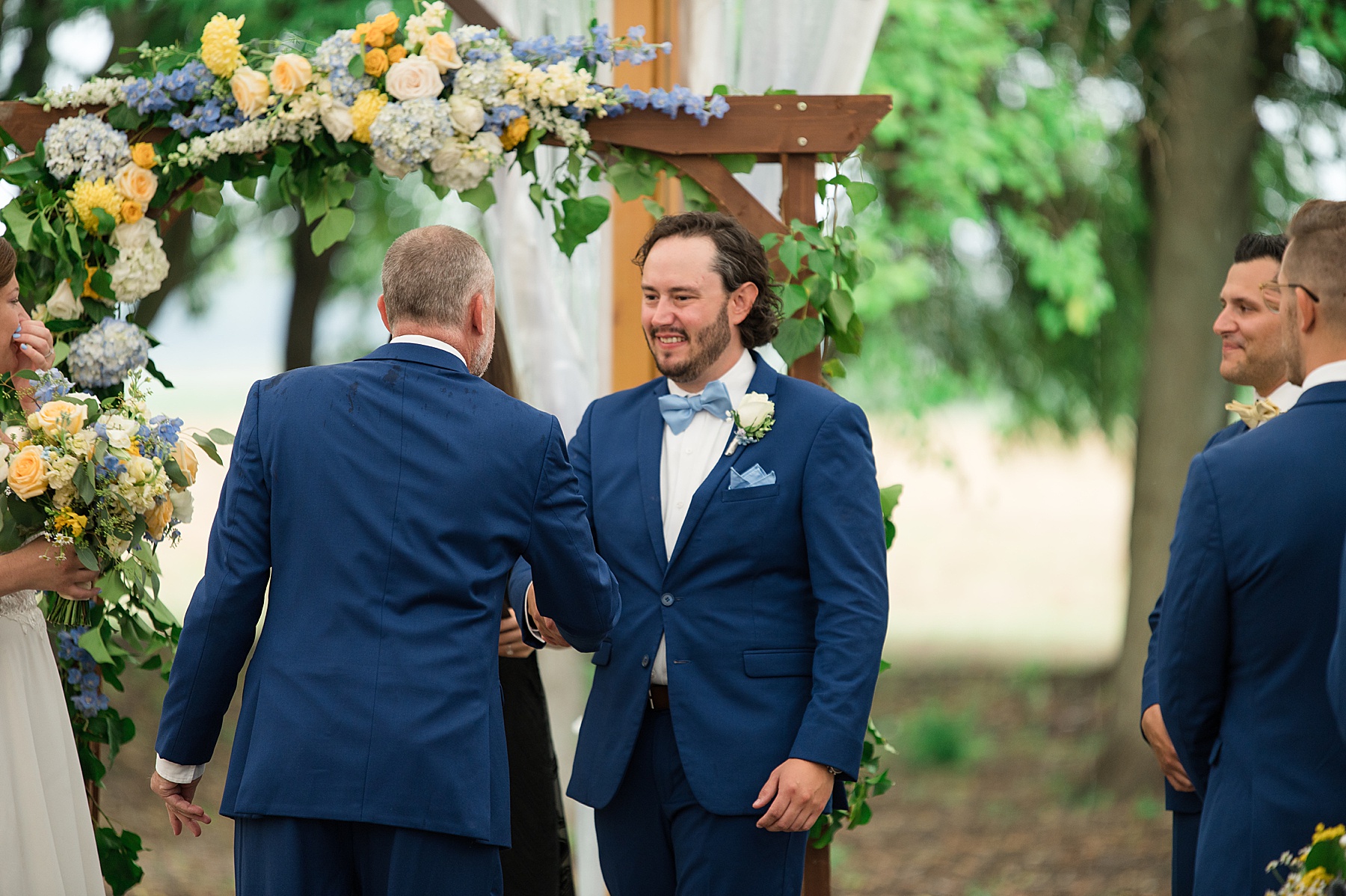 groom shakes father in law's hand