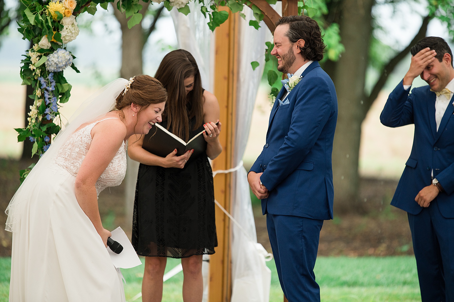 bride laughs at wedding vows