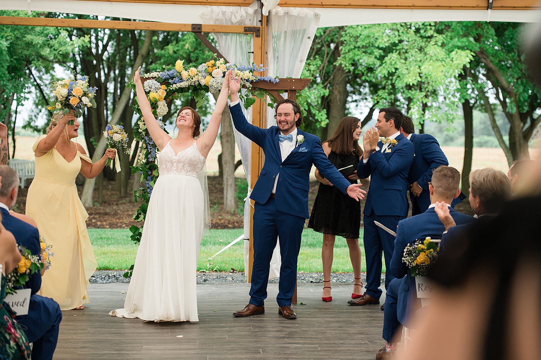 bride and groom celebrate after kiss