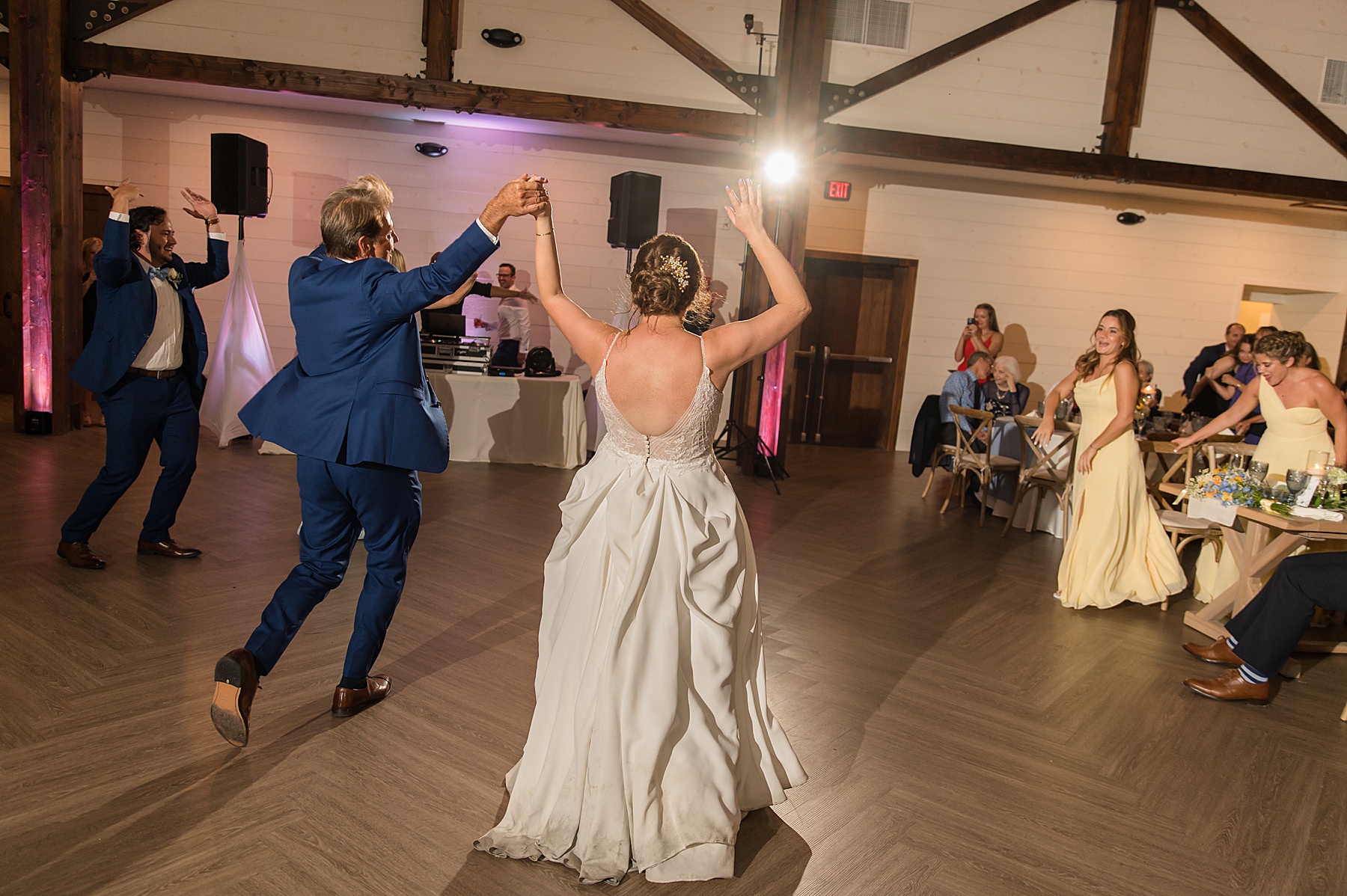 candid wedding guests dancing