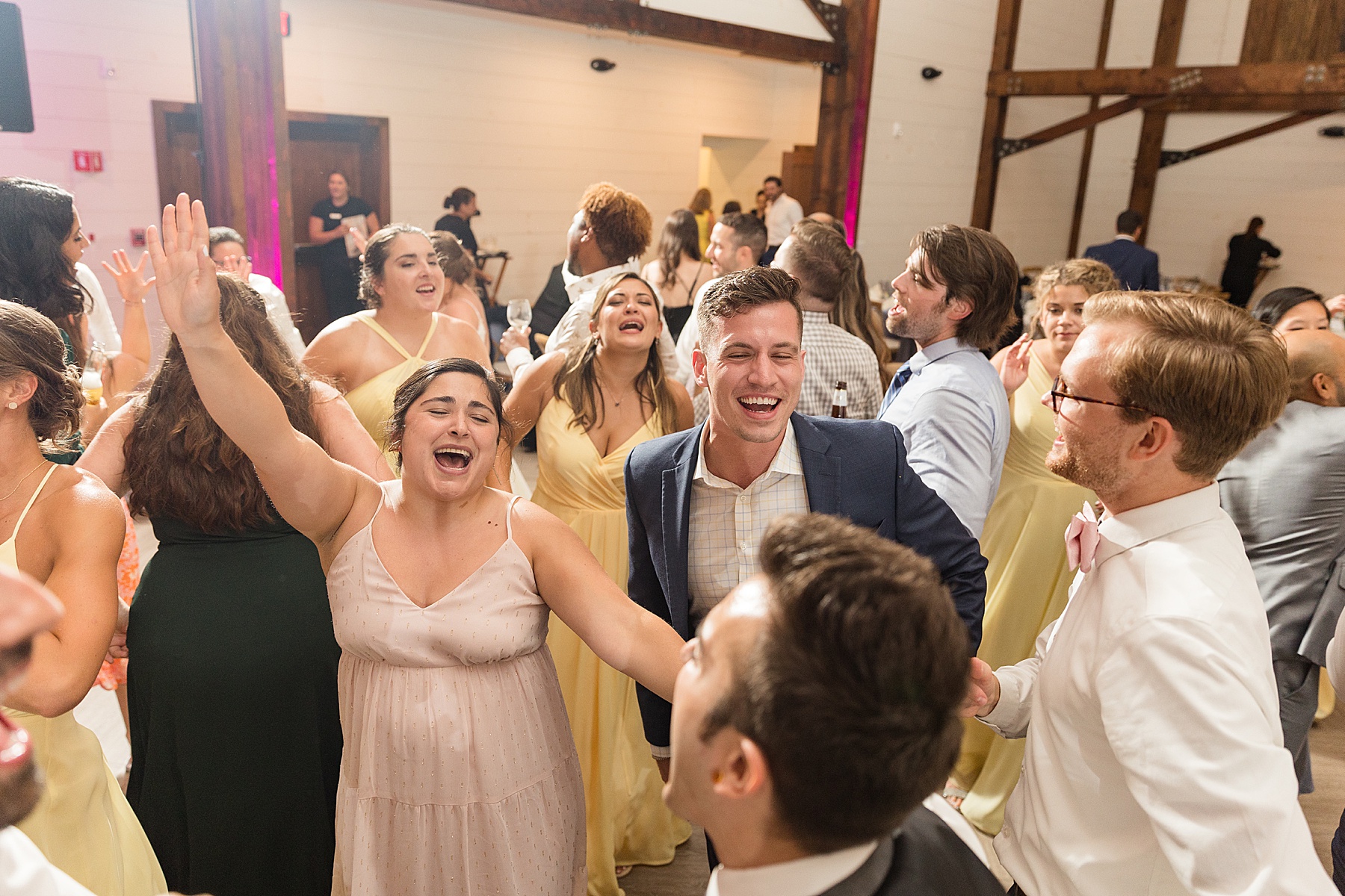 candid wedding guests dancing