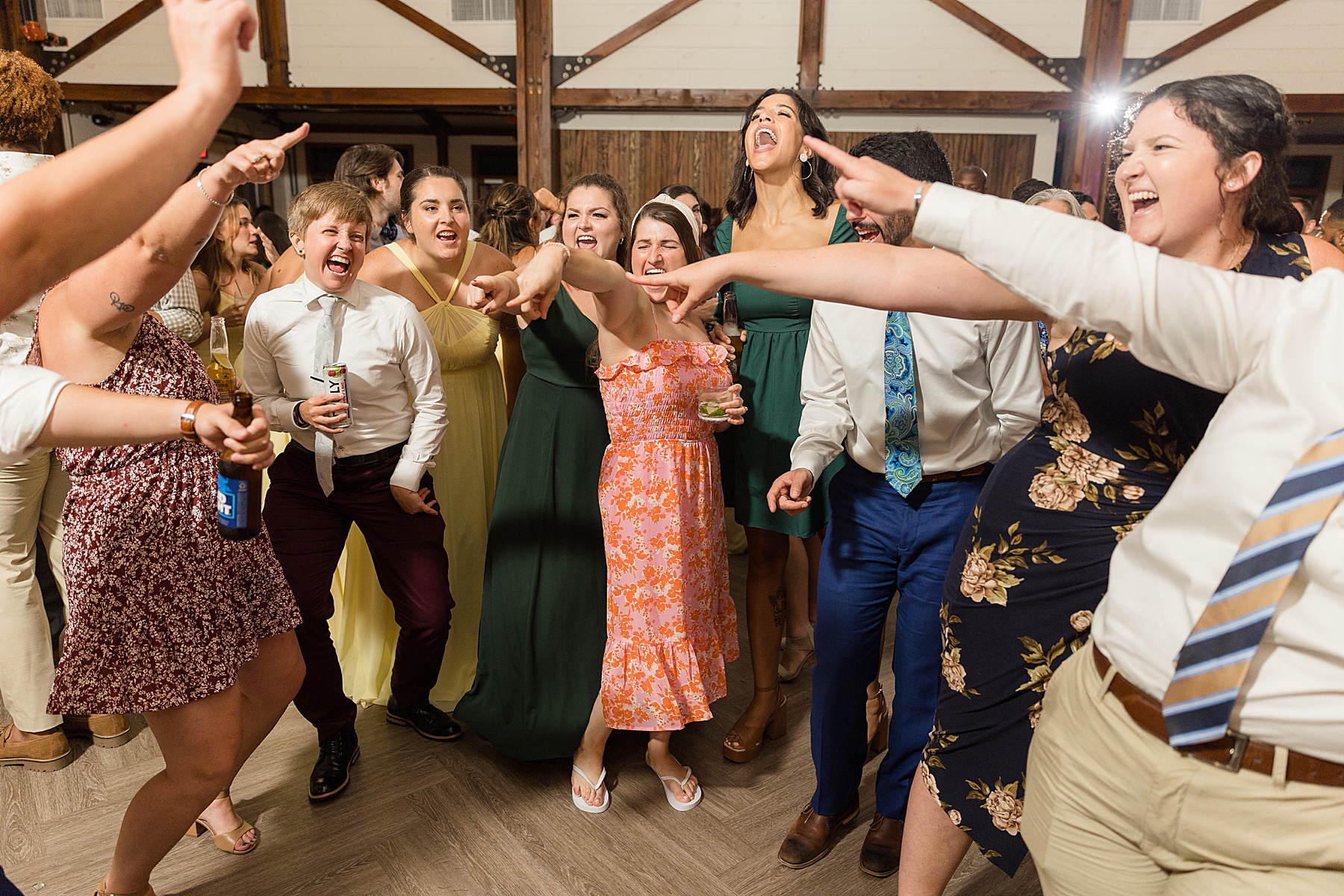 candid wedding guests dancing