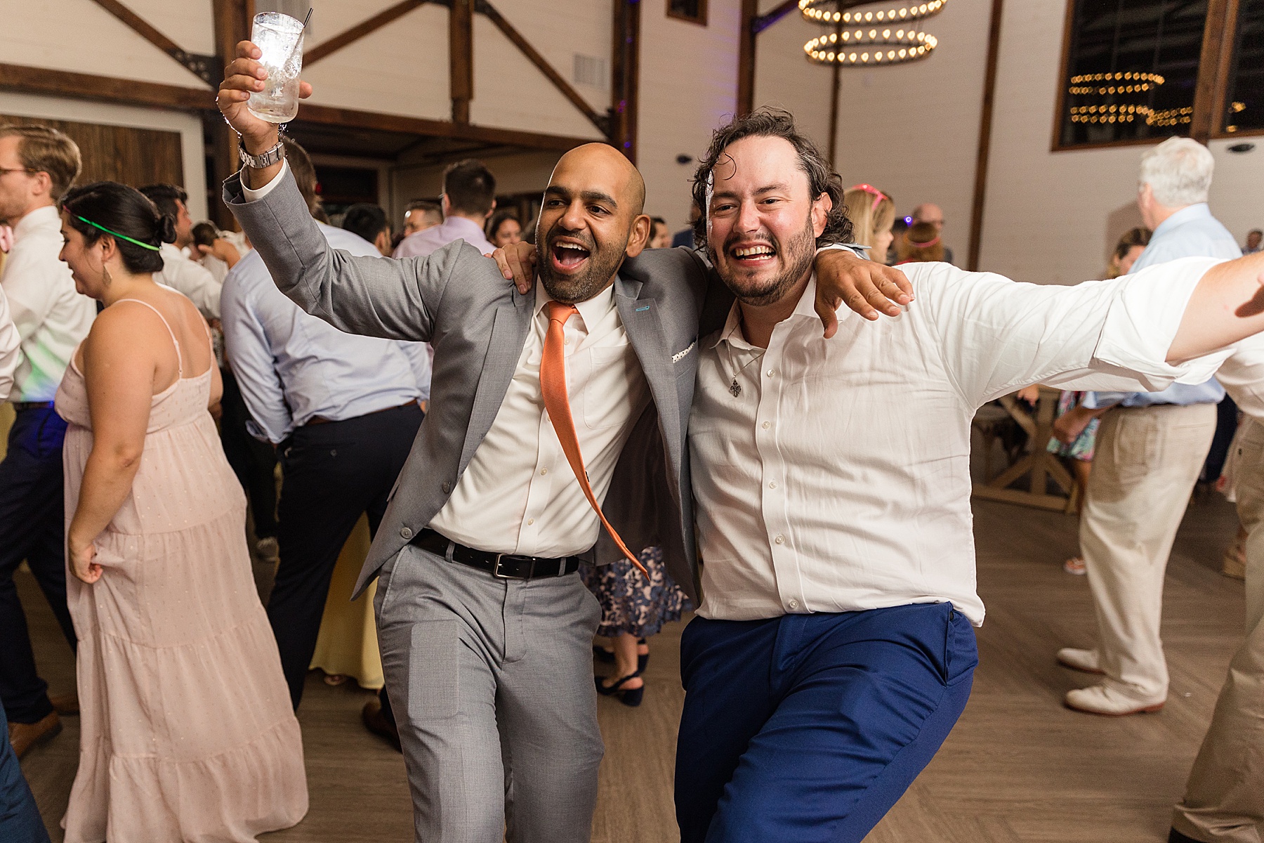 candid wedding guests dancing