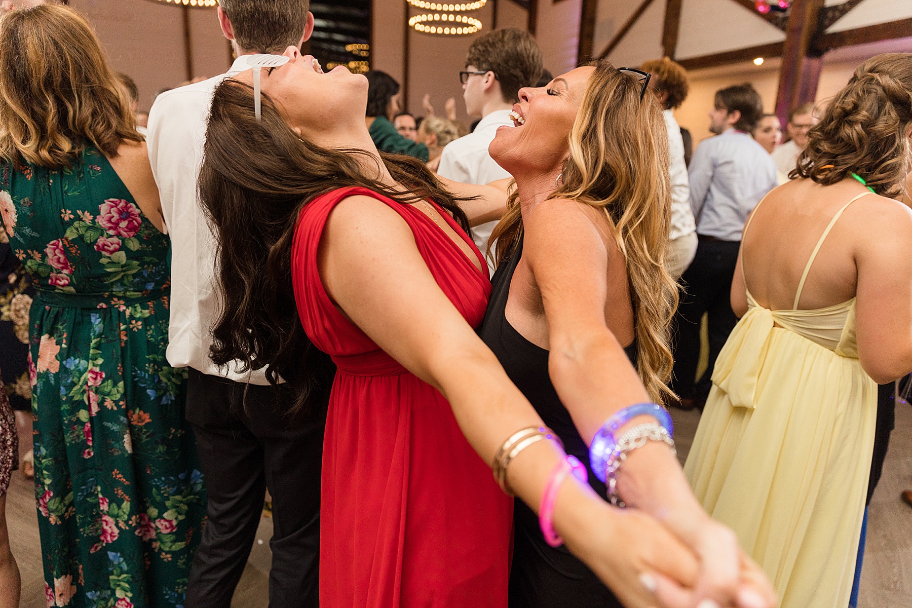 candid wedding guests dancing