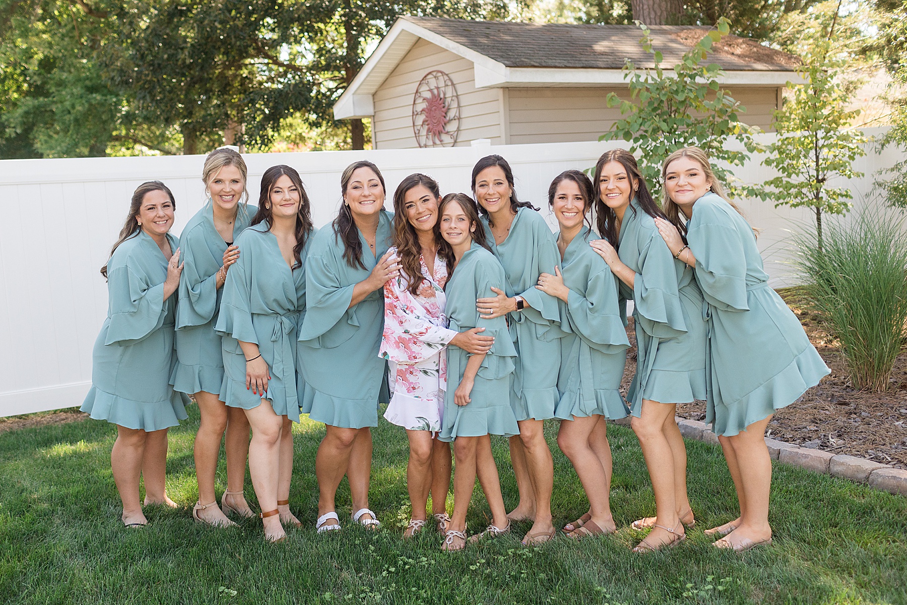 bride and bridemaids in teal robes