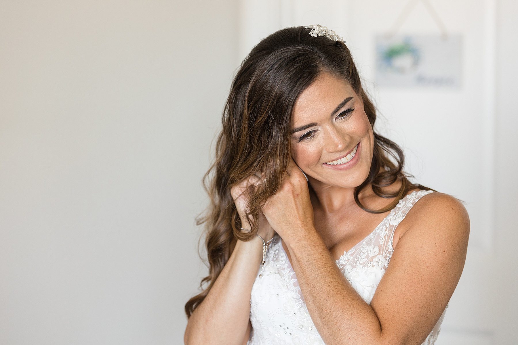 bride putting in earrings