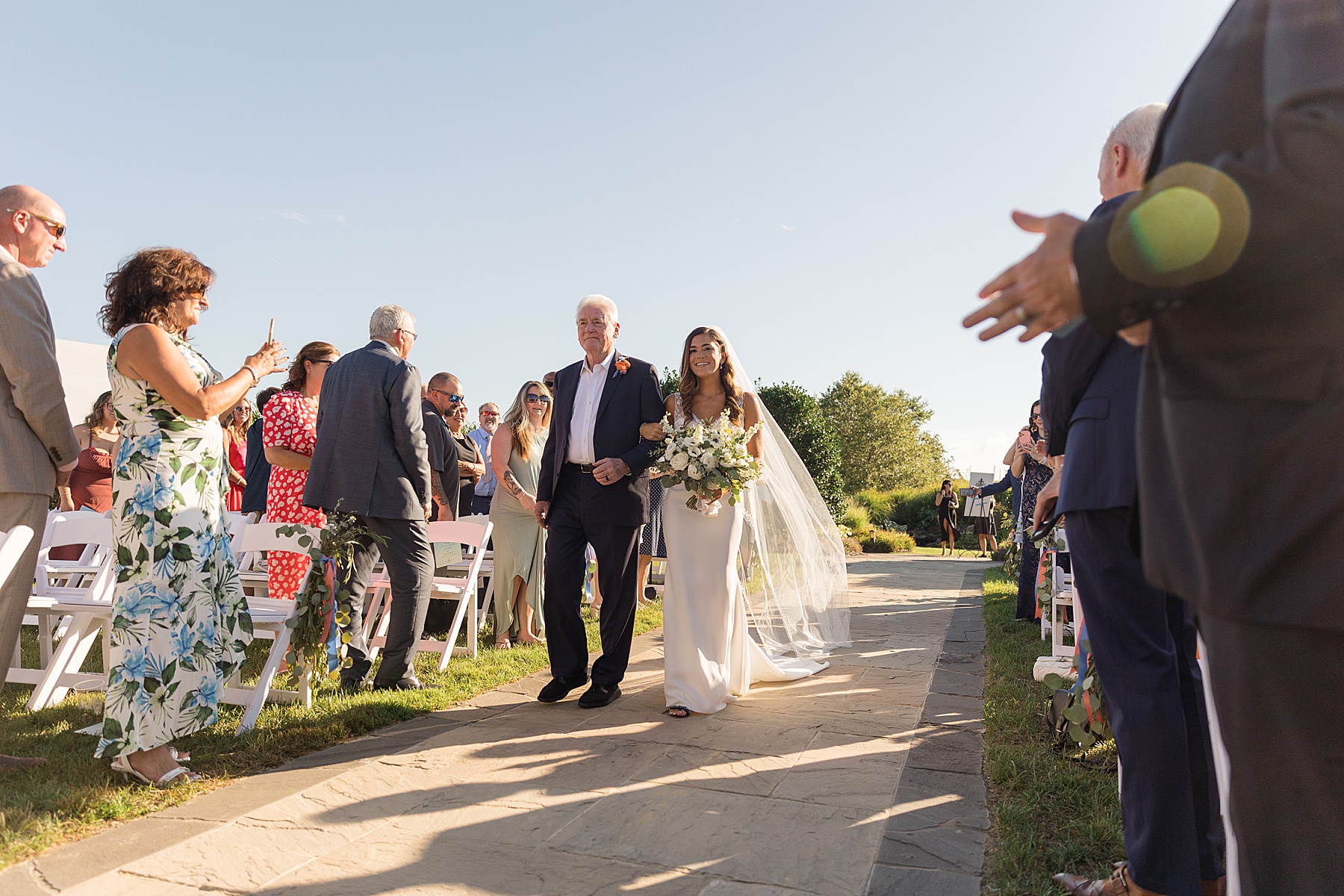 bride walking down the aisle with her dad