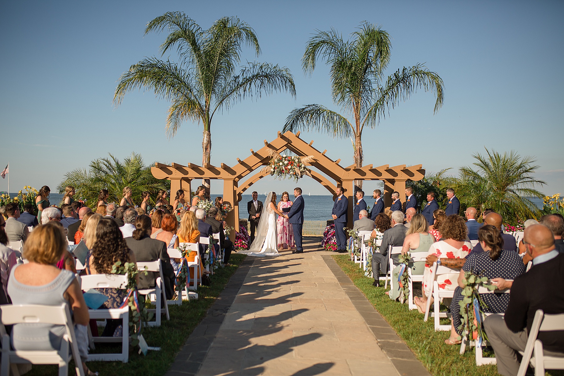 herrington on the bay coastal ceremony palm tree