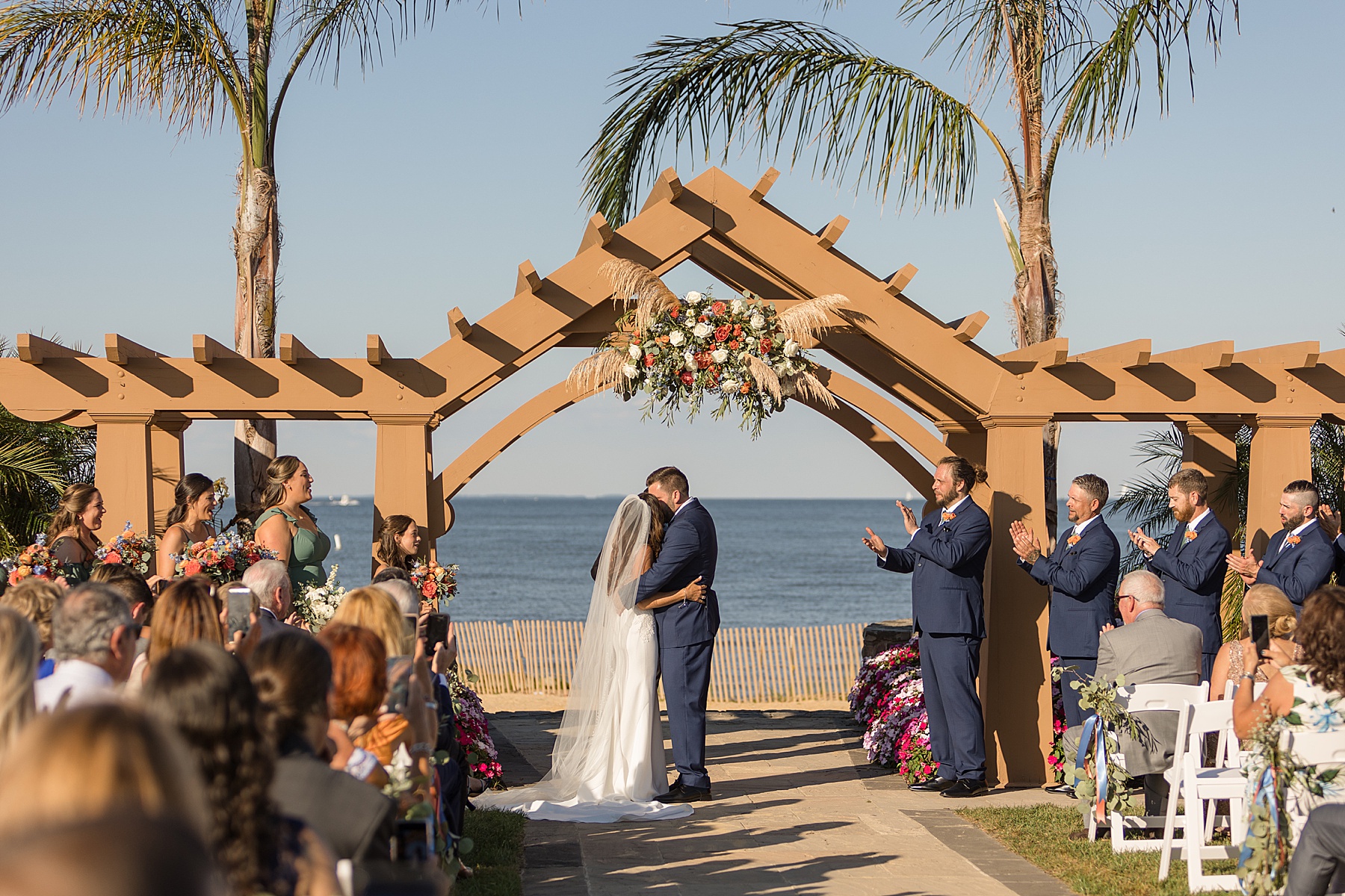 herrington on the bay coastal ceremony palm tree first kiss