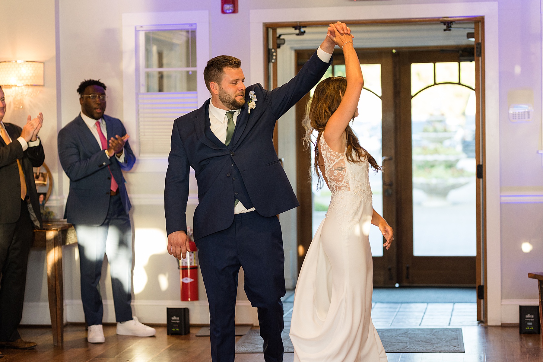 bride and groom grand entrance into reception