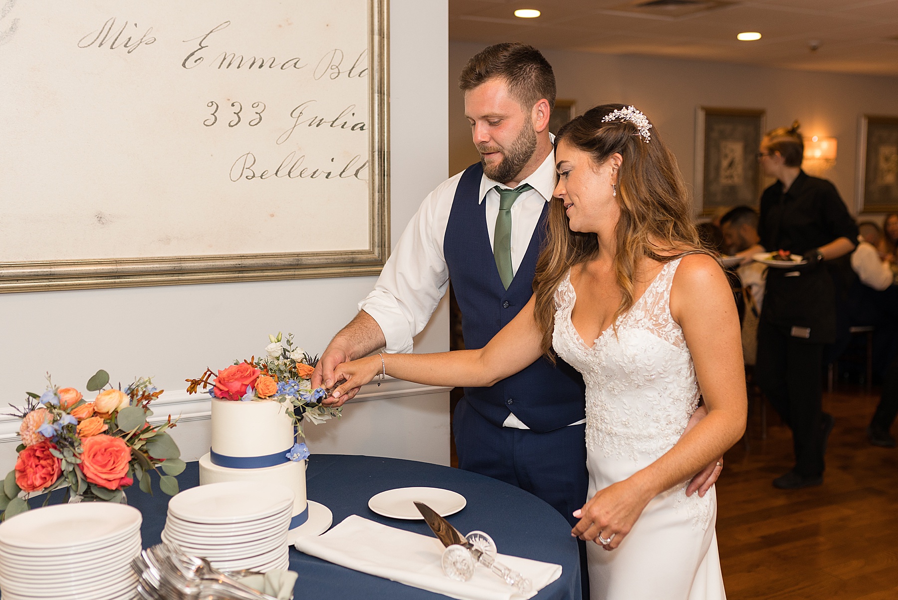 bride and groom cut the cake