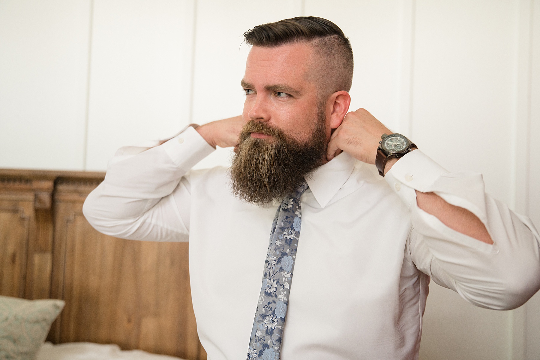 groom getting ready fixing collar