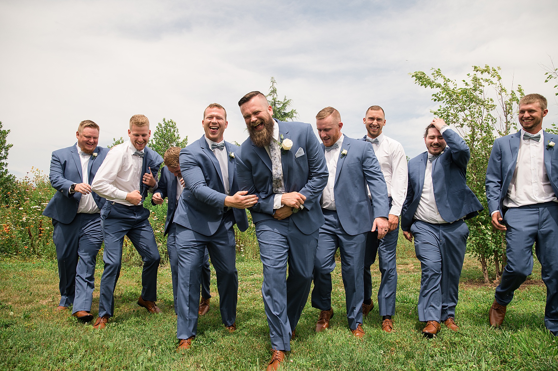 groom and groomsmen portrait navy suits funny