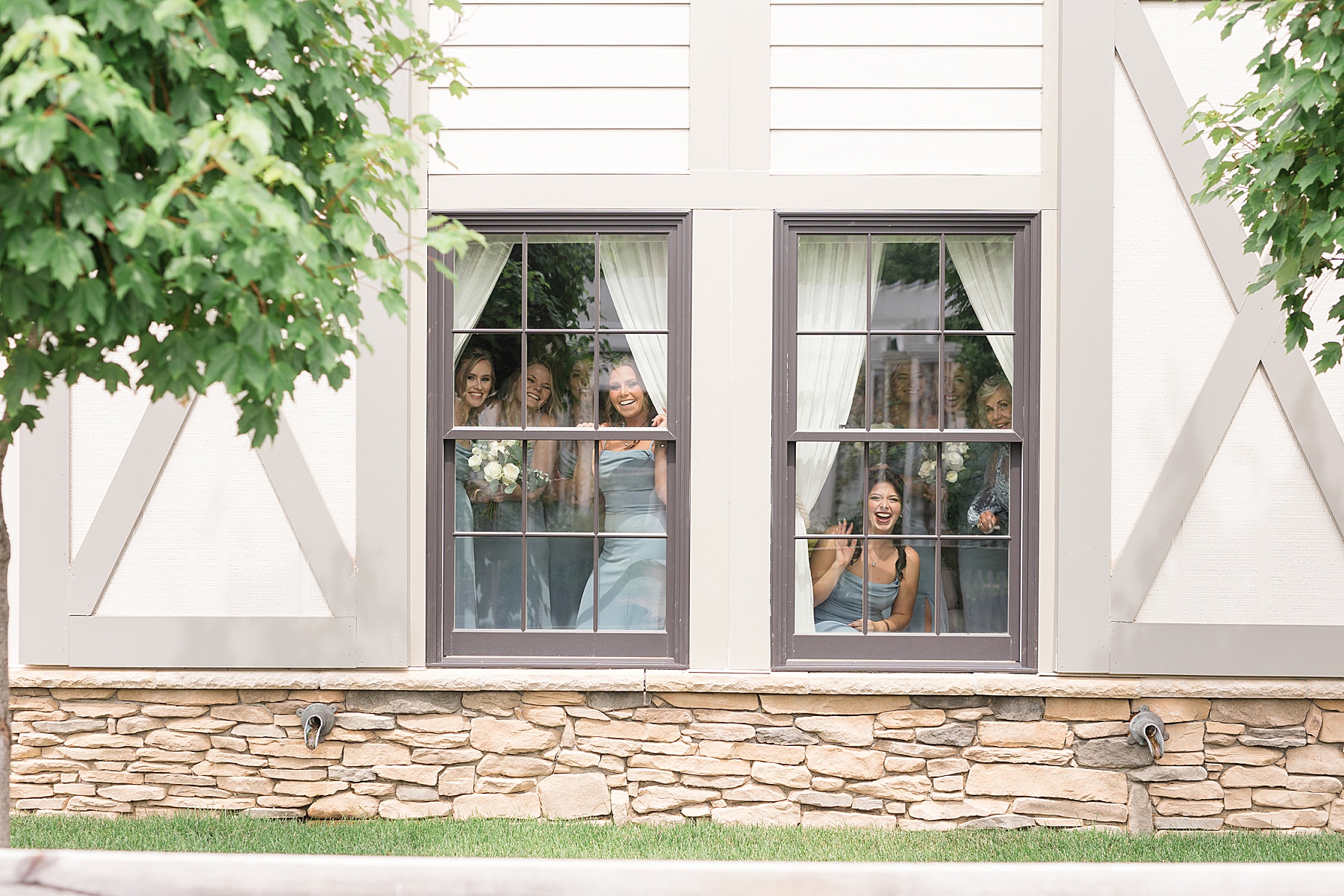 bride and groom first look bridesmaids watching through window