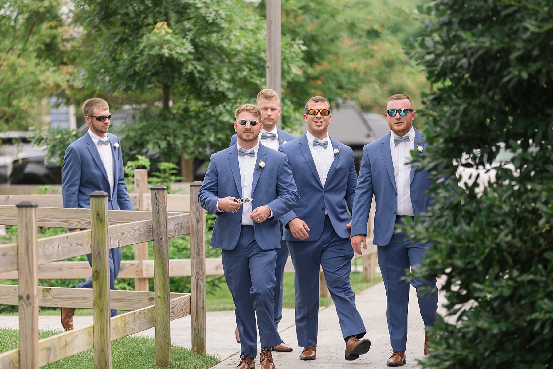 groomsmen walking with swag