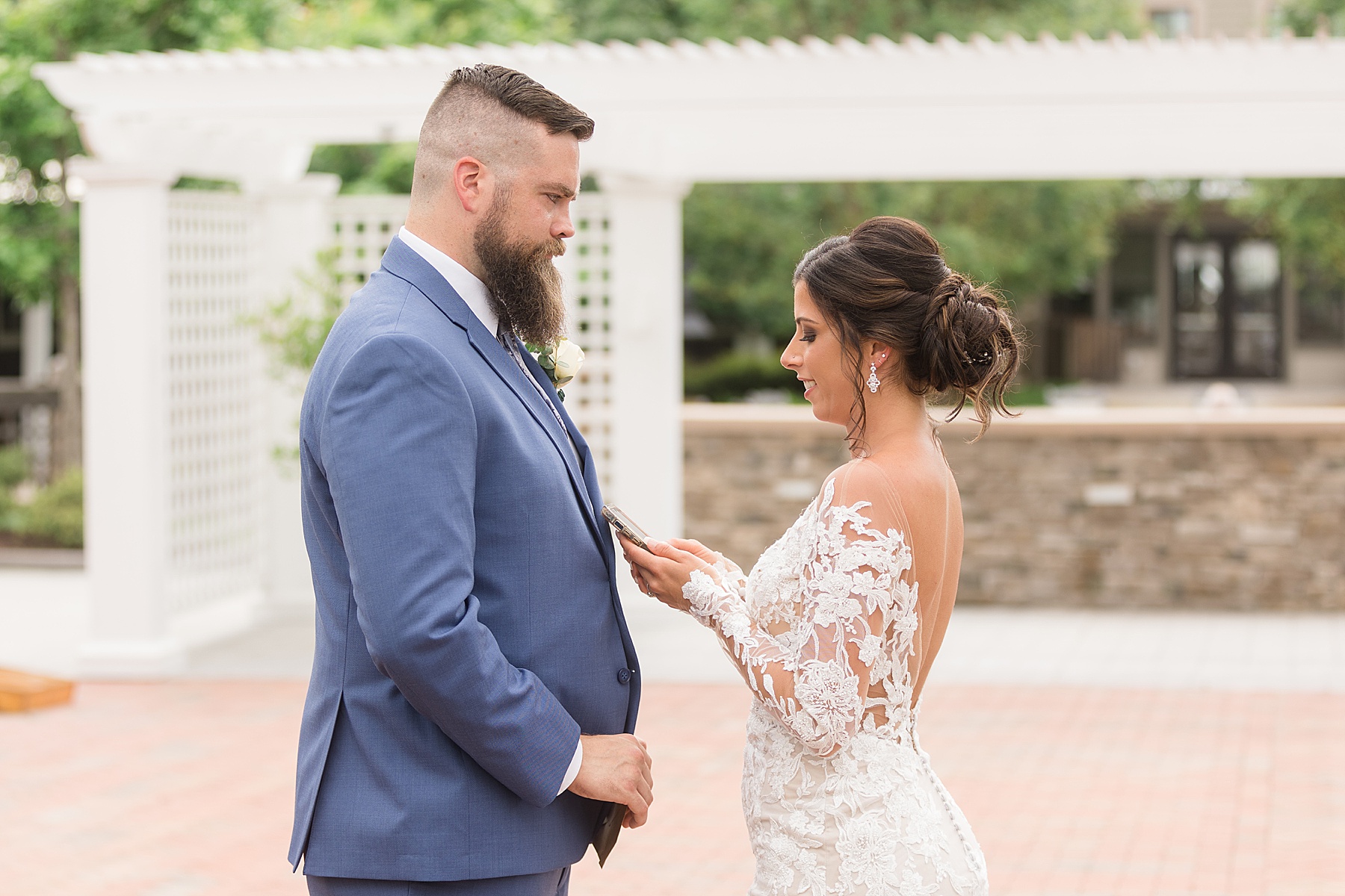 bride reading vows after first look