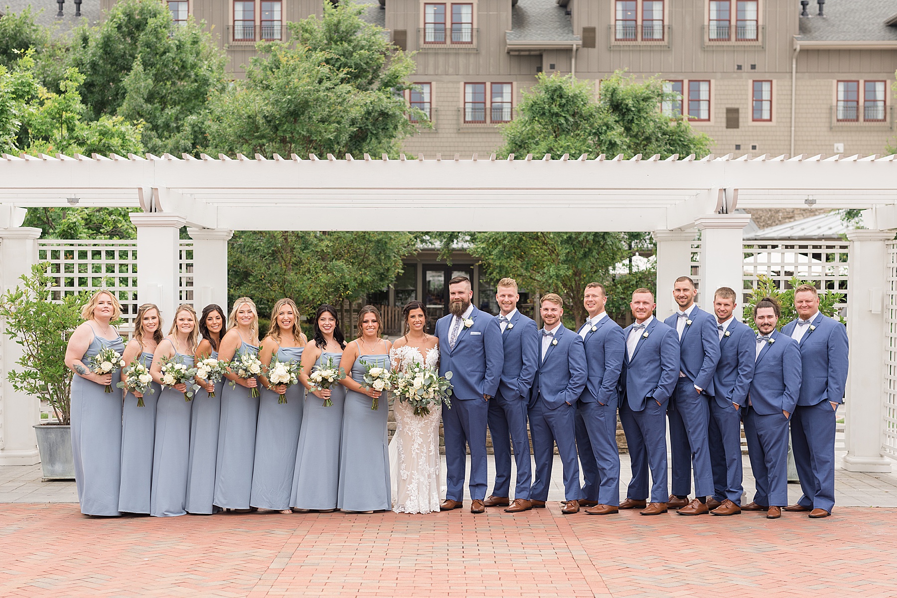 full wedding party under courtyard arbor chesapeake bay beach club inn