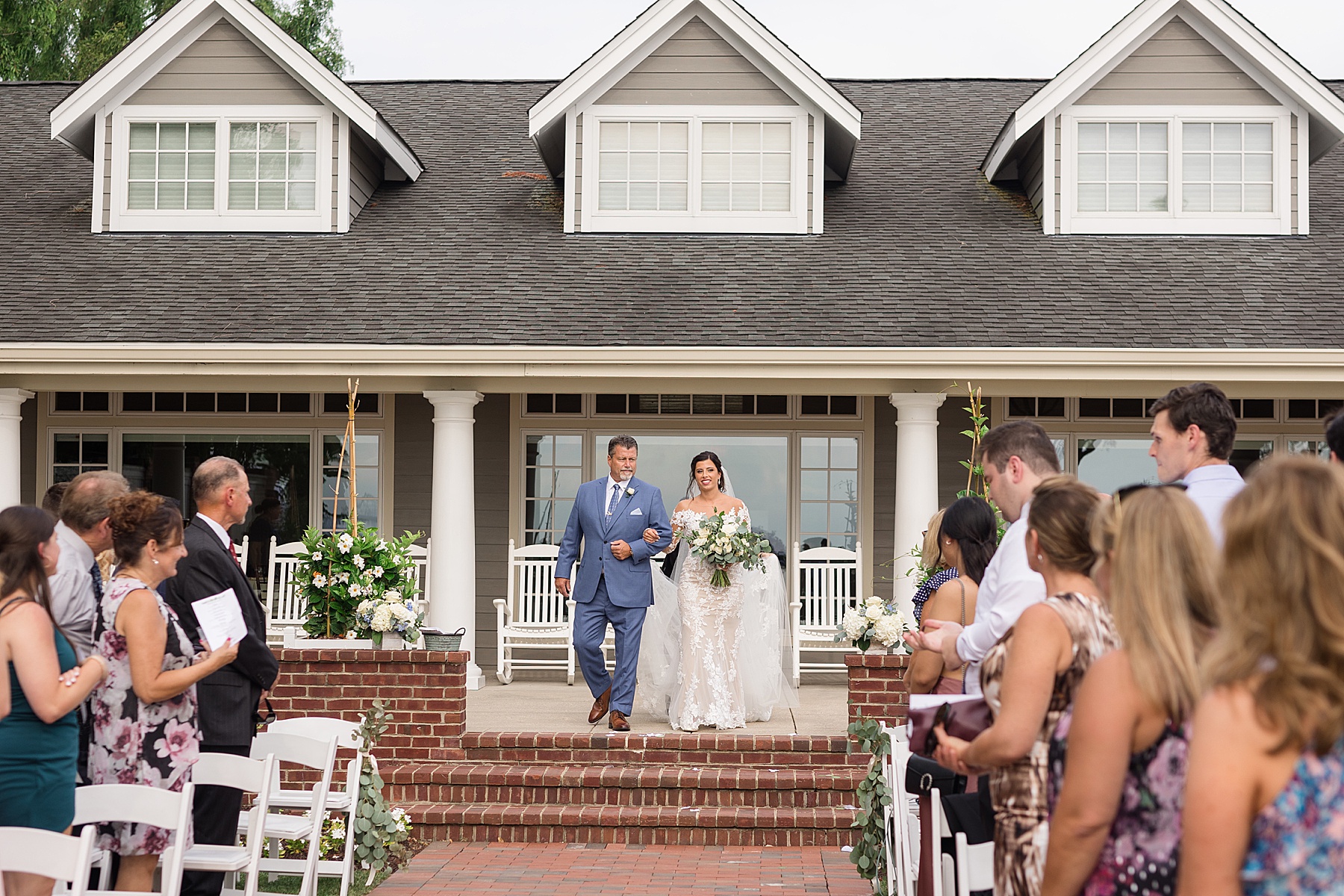 bride and her dad walk down aisle