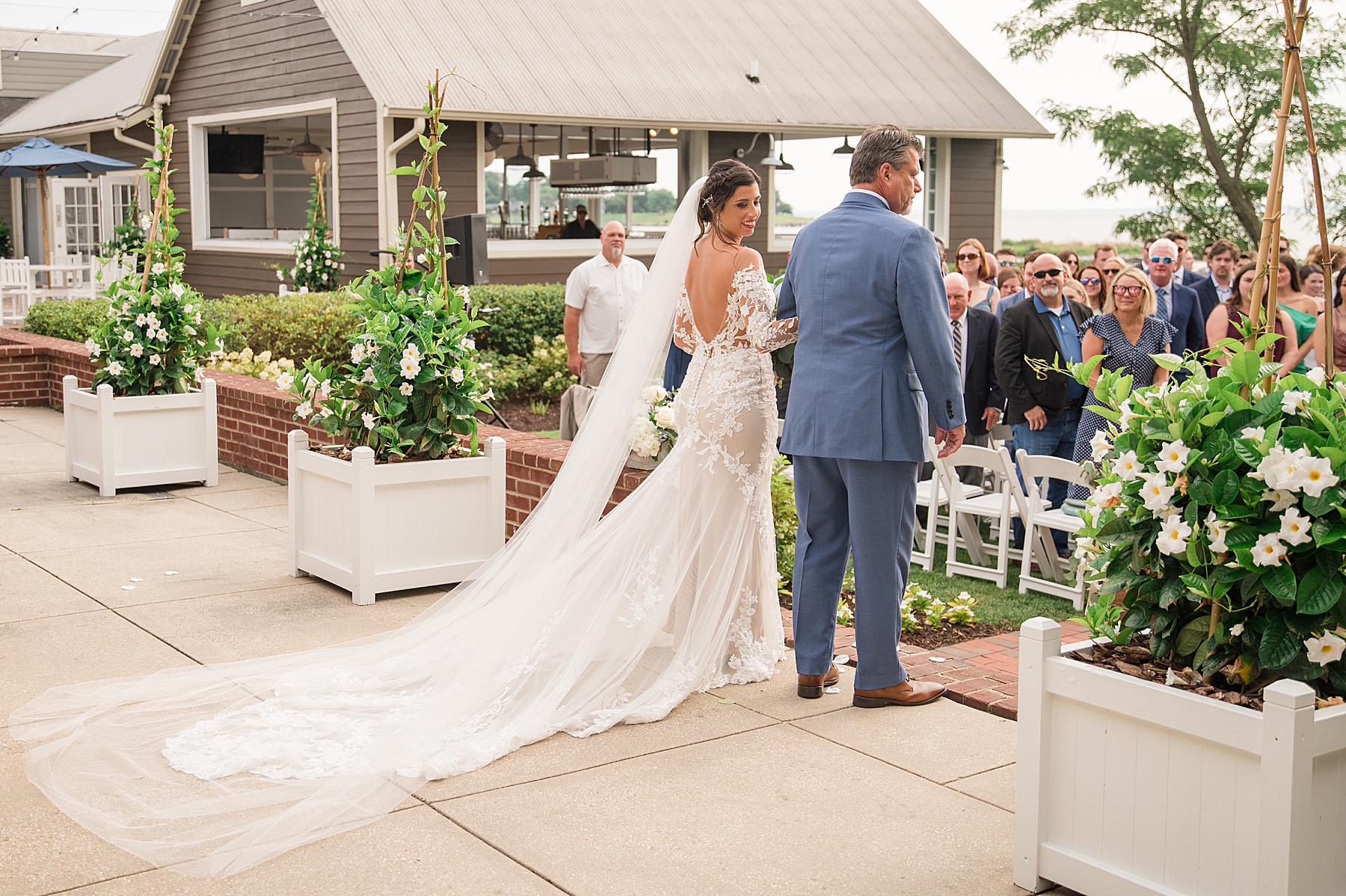 bride and her dad walk down aisle