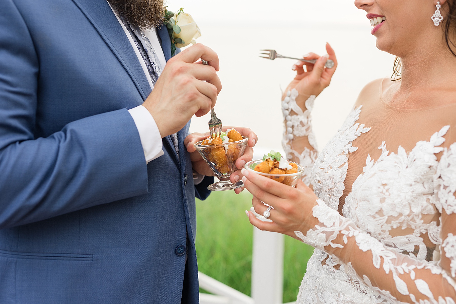 bride and groom eating tater tots