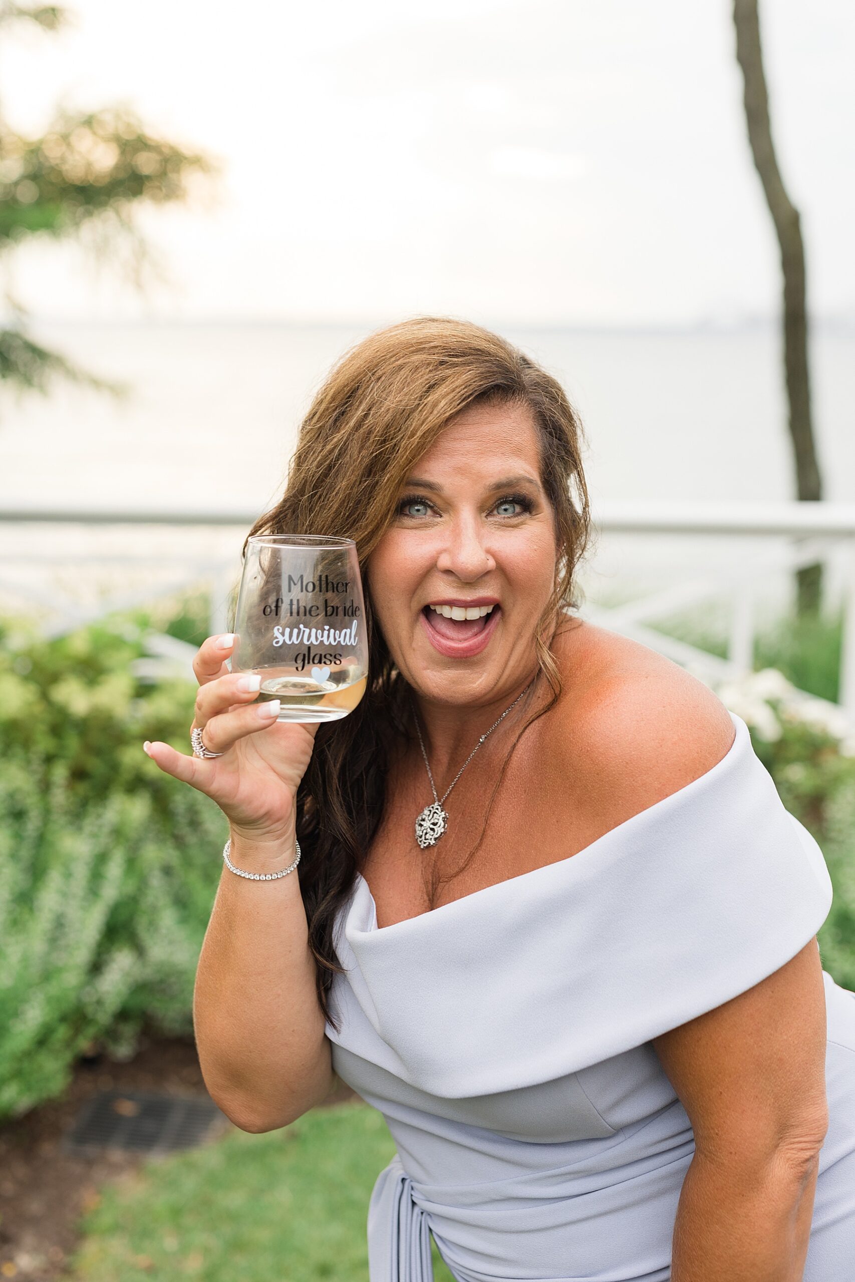 mother of the bride holding wine glass