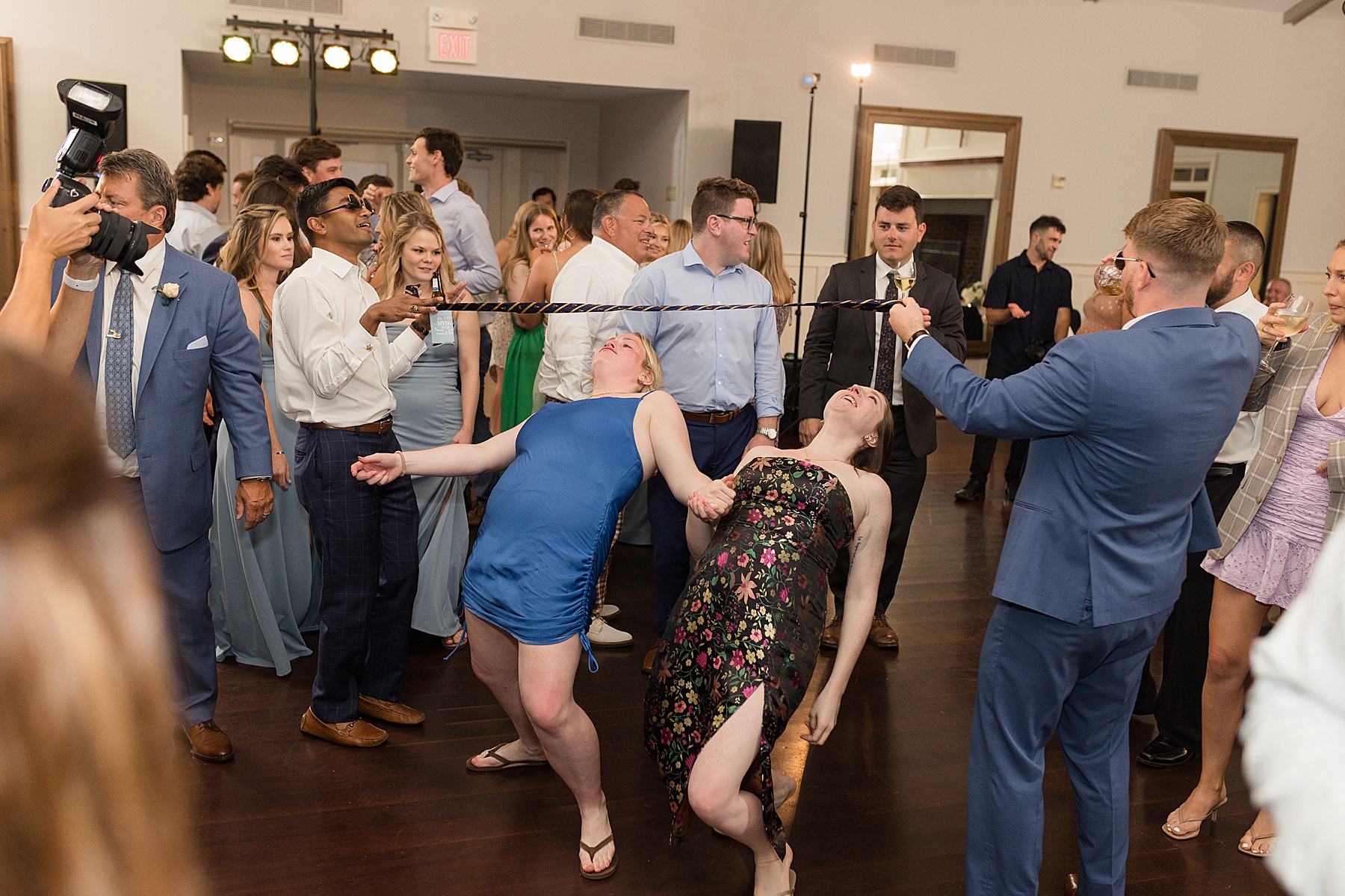 candid guests dancing reception limbo