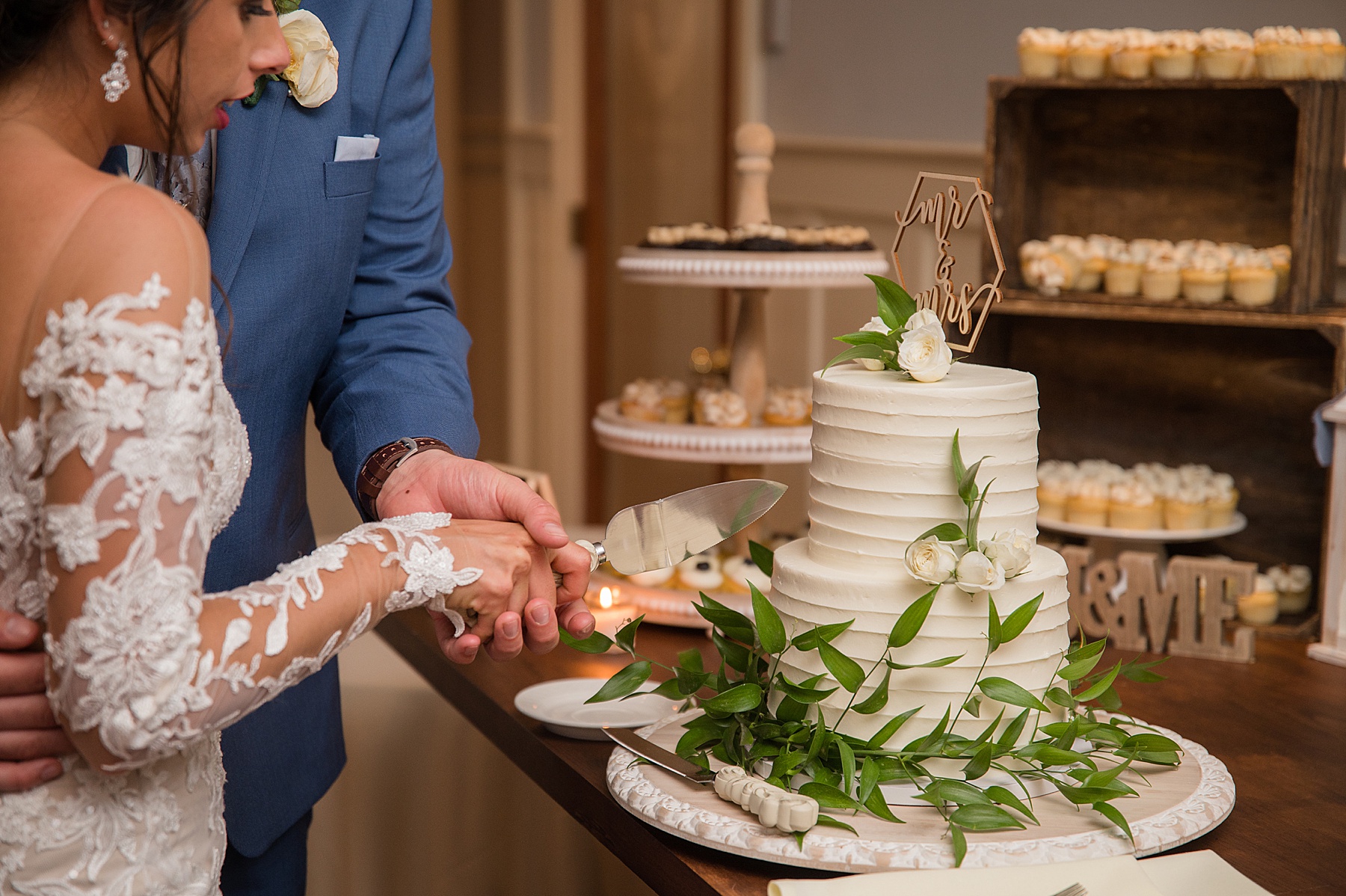 bride and groom cut the cake