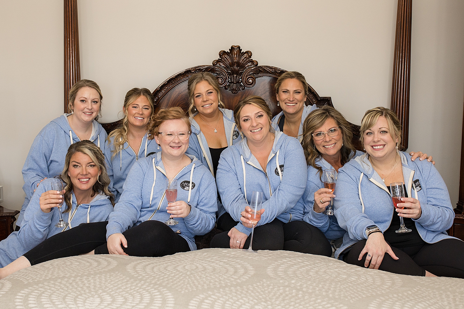 bridesmaids in matching hoodies getting ready