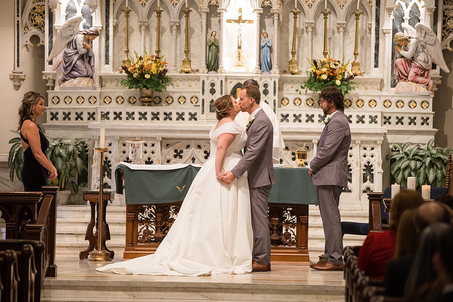 wedding first kiss church altar catholic