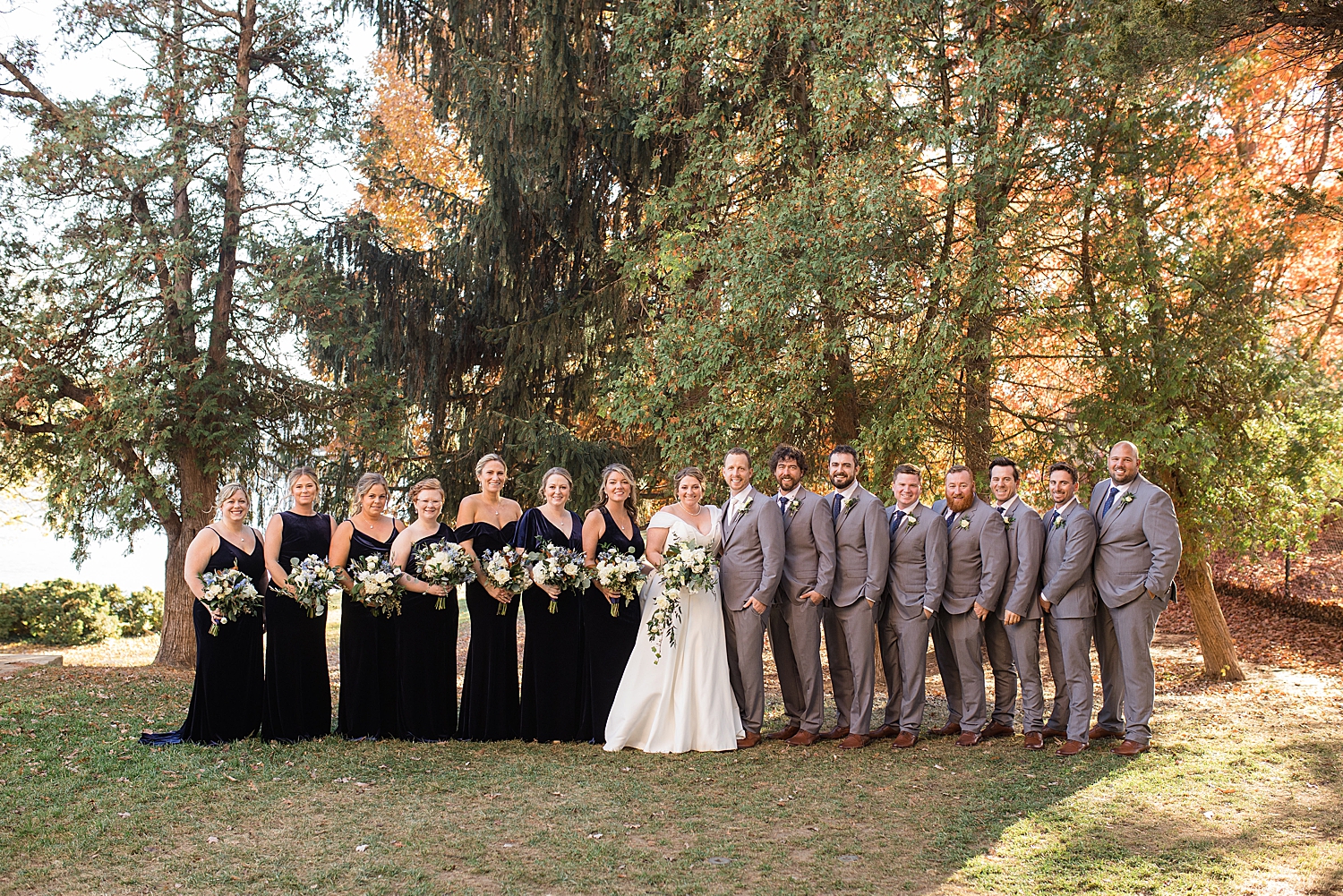 newlyweds with full wedding party