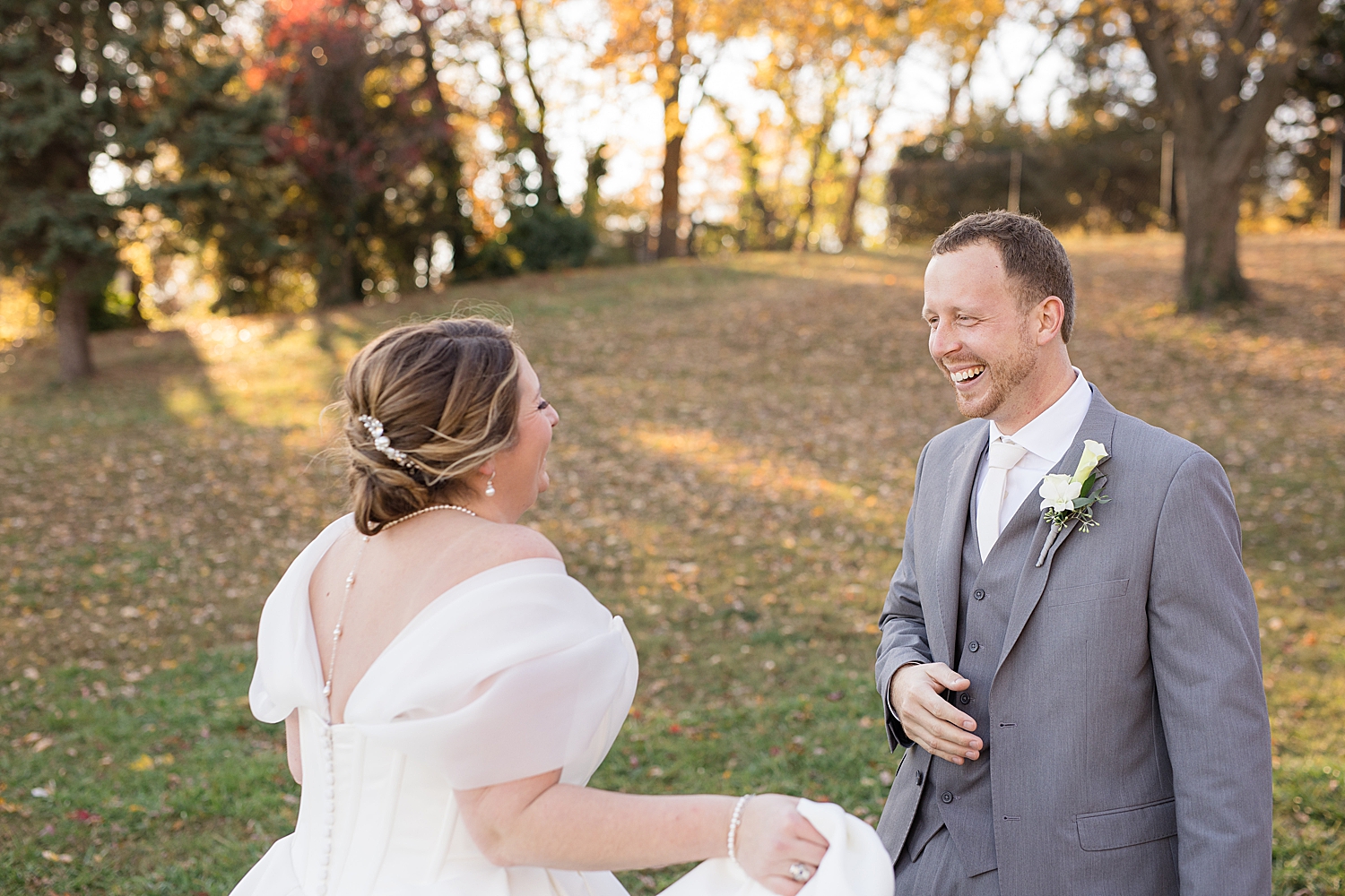 groom and bride laughing together