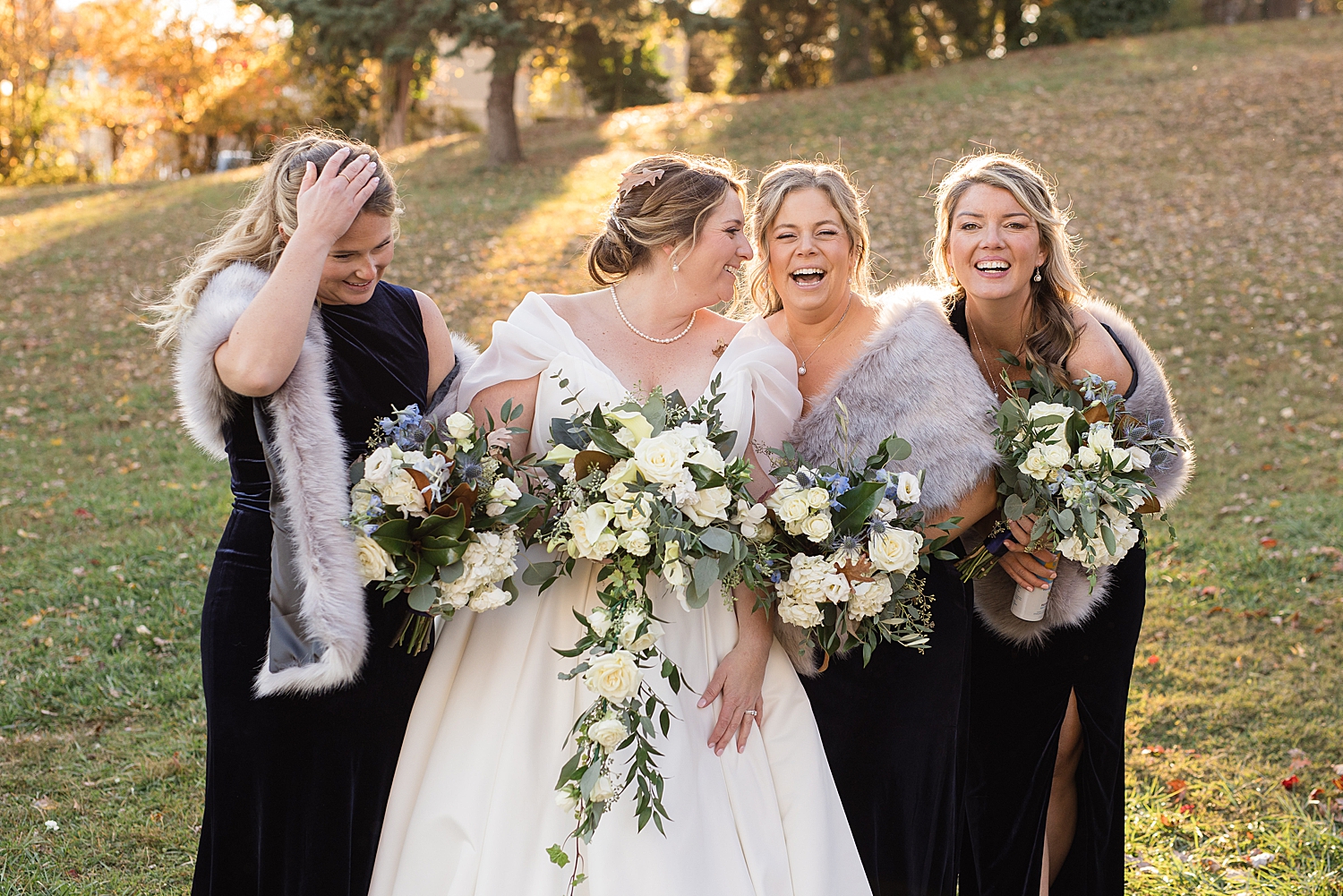 bride laughing with bridesmaids