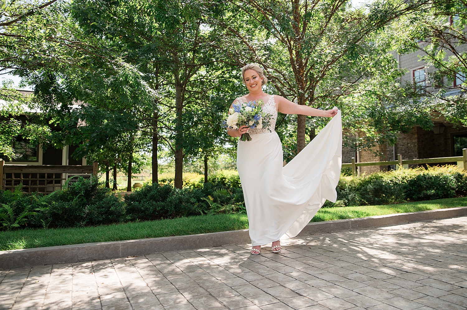 bridal portrait gown bouquet green trees