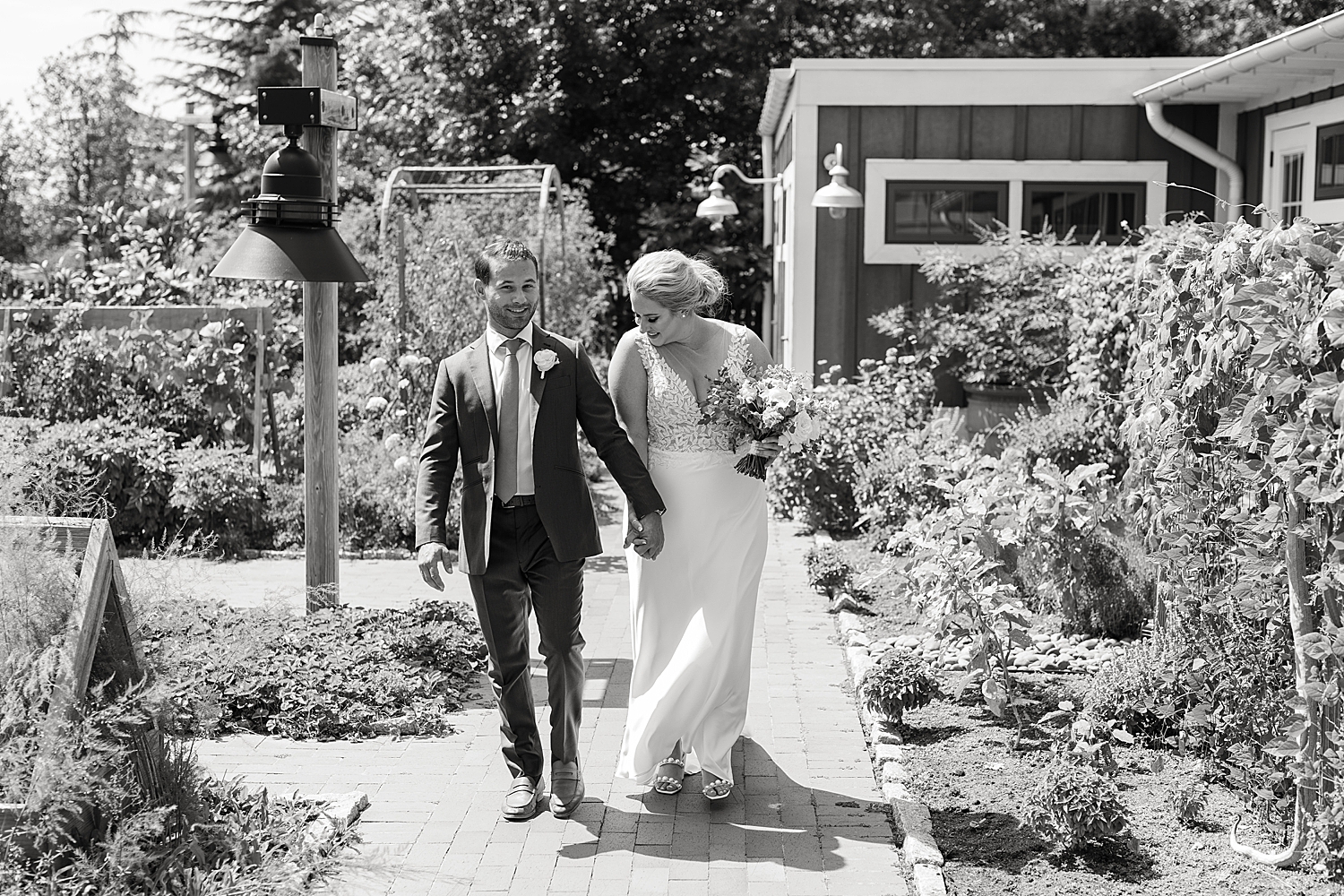 bride and groom portrait walking black and white