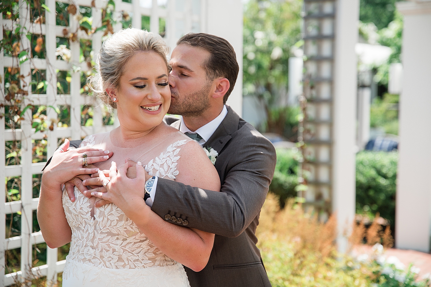 couple portrait groom kissing bride