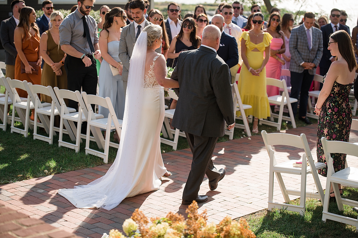 bride walking down aisle with dad