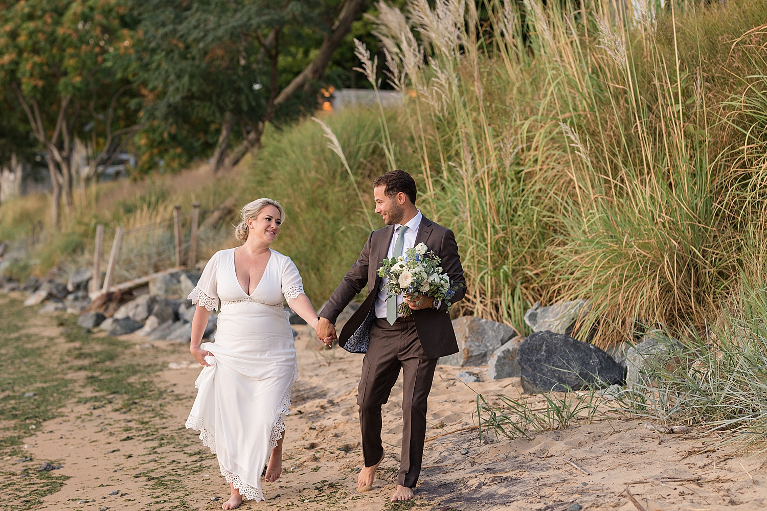 bride and groom portrait sunset beach walking