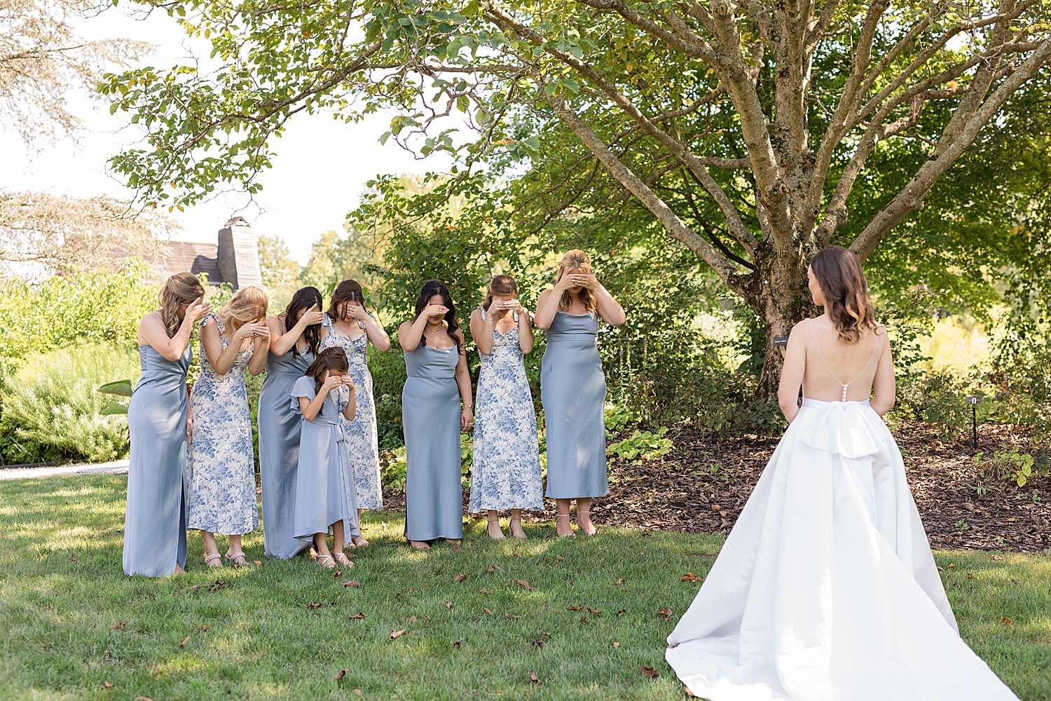 bride first look with bridesmaids in blue florals