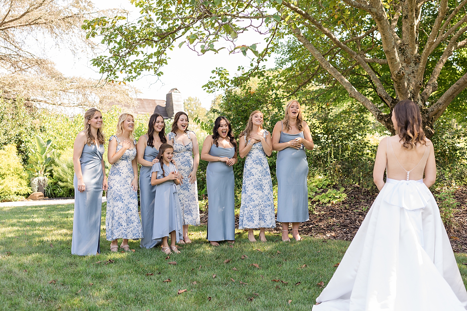 bride first look with bridesmaids in blue florals