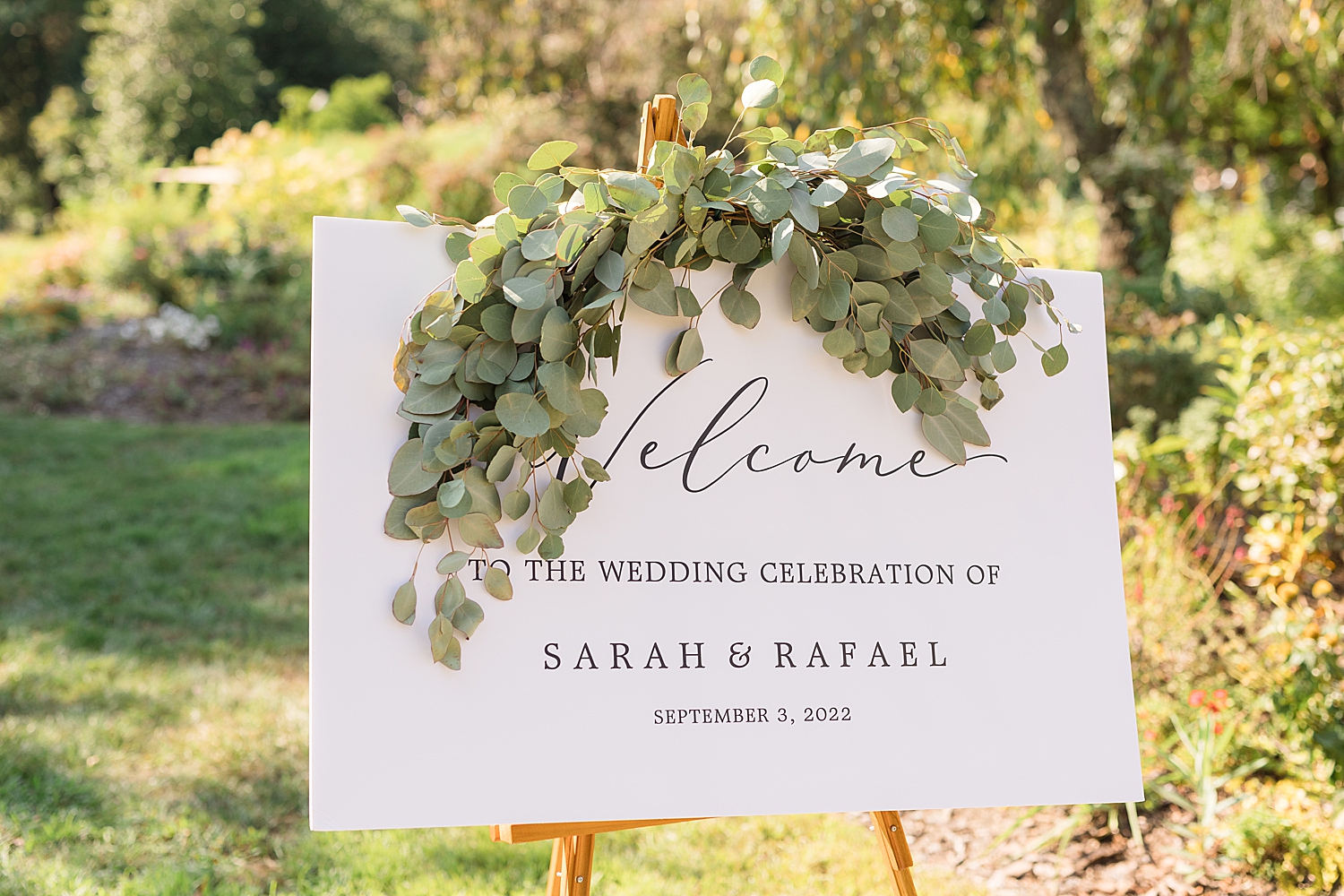 wedding welcome sign with greenery