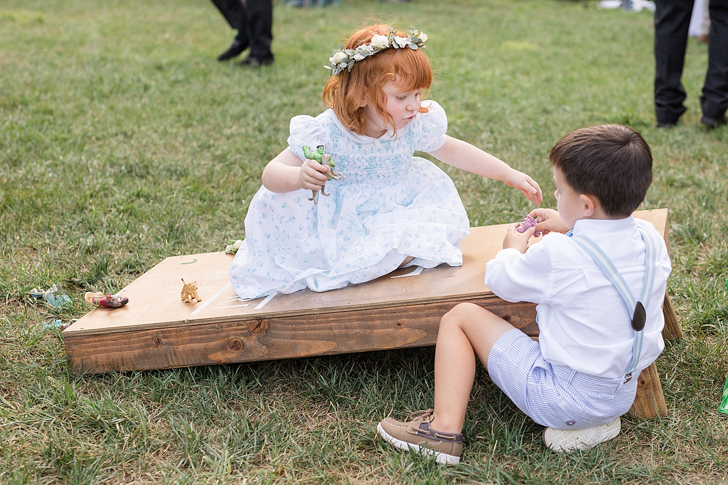 guests candid cocktail hour flower girl cornhole