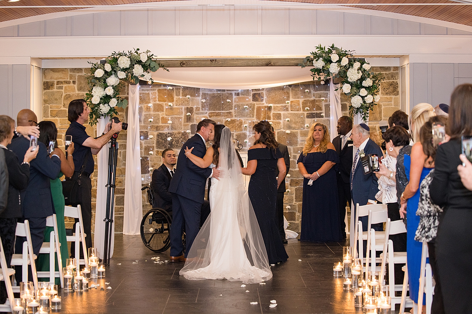 bride walking down the aisle with her parents